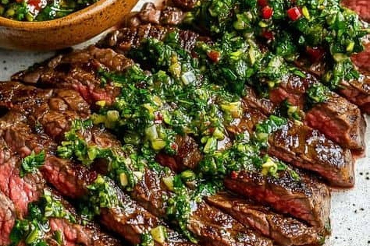 Grilled skirt steak sliced and served with chimichurri