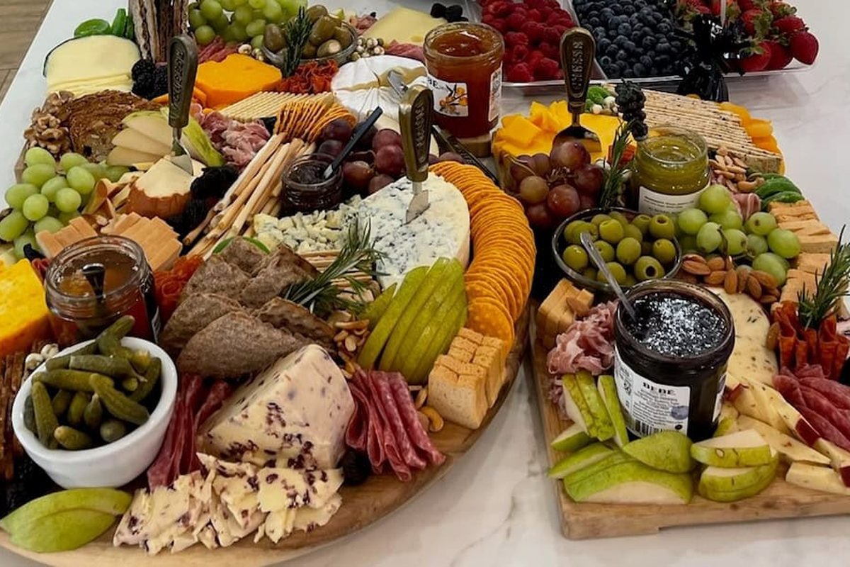 Charcuterie platter with cured meats, cheeses, fruit and olives